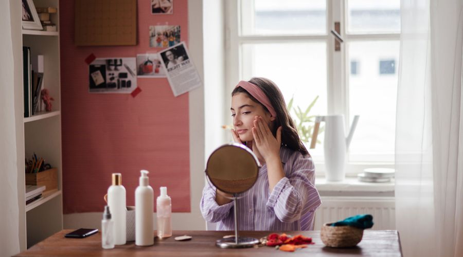 Teenage girl doing her skin care