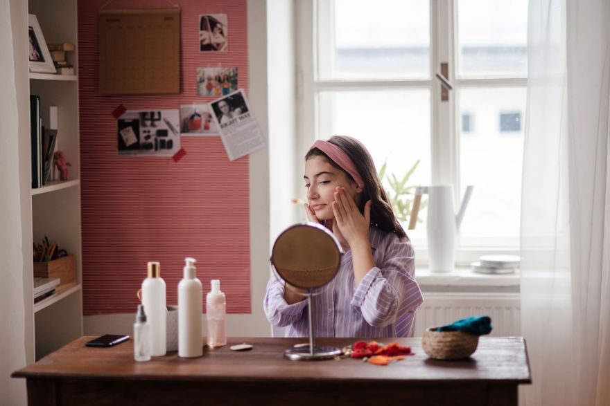 Teenage girl doing her skin care